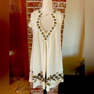 Cream dress with beautiful embellishments.